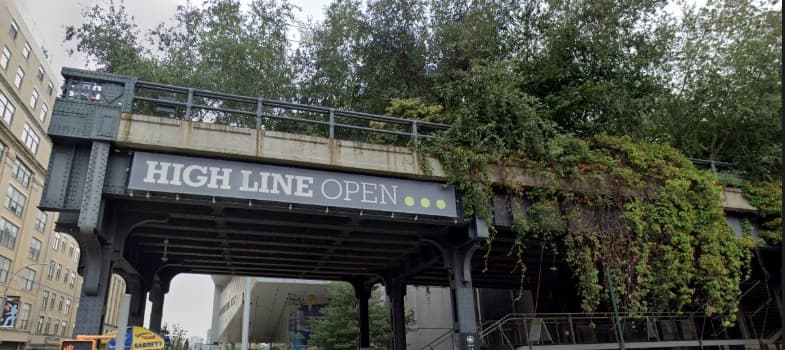 High Line elevated structure with HIGH LINE OPEN banner and greenery